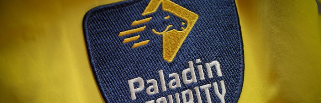 https://www.paladinsecurity.com/wp-content/uploads/2016/11/paladin-security-badge.jpg